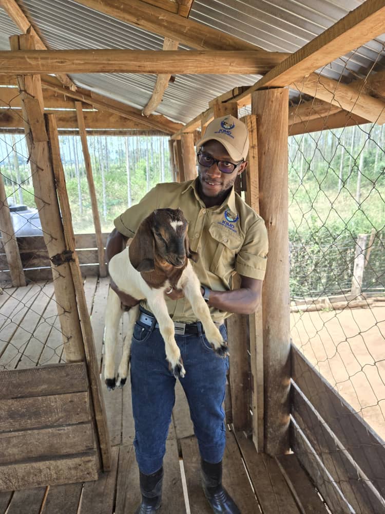 man holding a goat